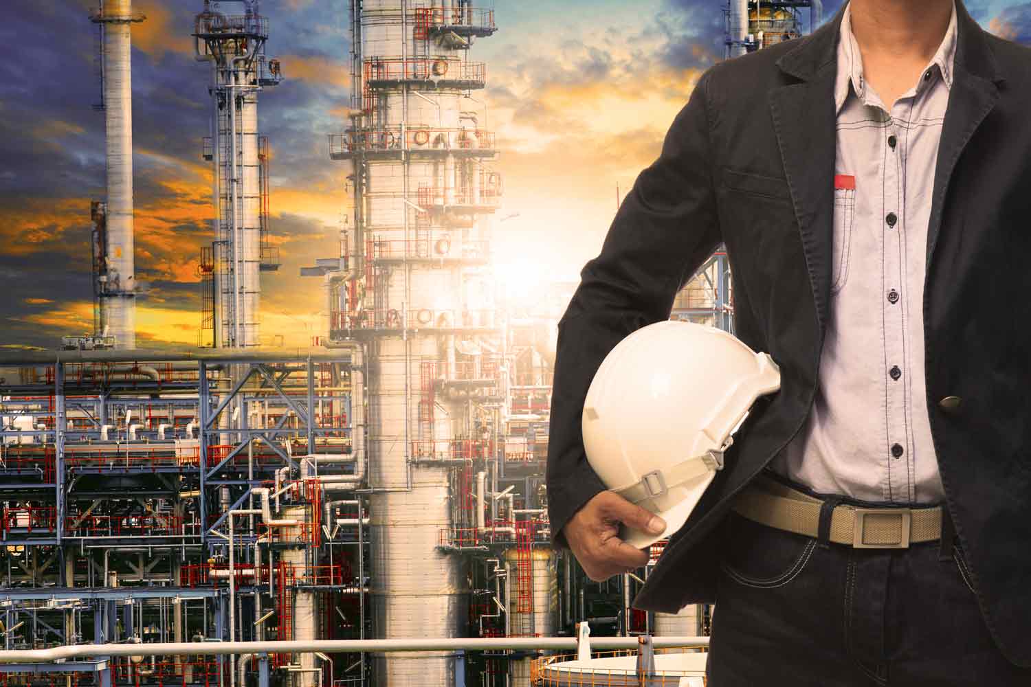 dreamstime_m_44842768-Engineering-man-with-white-safety-helmet-standing-in-front-of-oil-refinery-building—Image